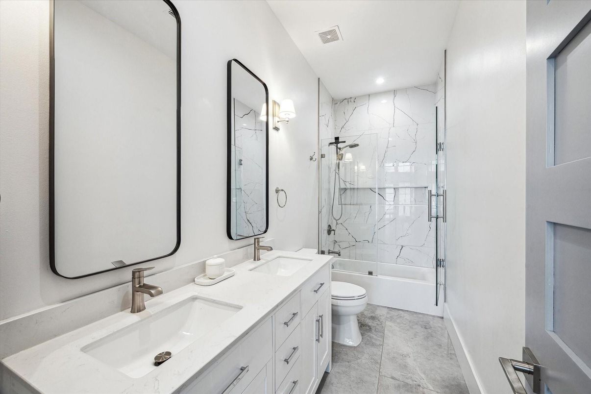 Bathroom, Dual Sink Vanities, Glass Shower, Interior, Marble, Marble Walls, Recessed Lighting