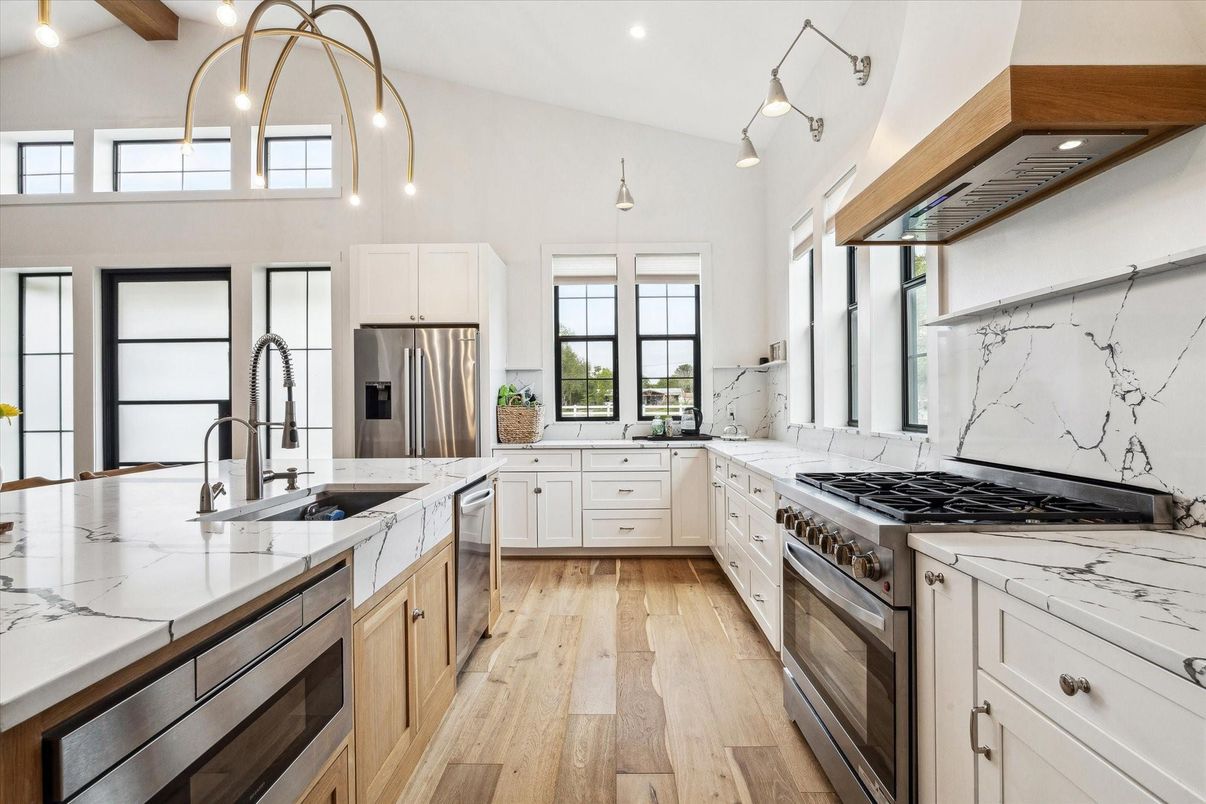 Interior, Kitchen, Marble Walls, Pendant Lights, Recessed Lighting, Stainless Steel Appliances, Wood Texture Flooring