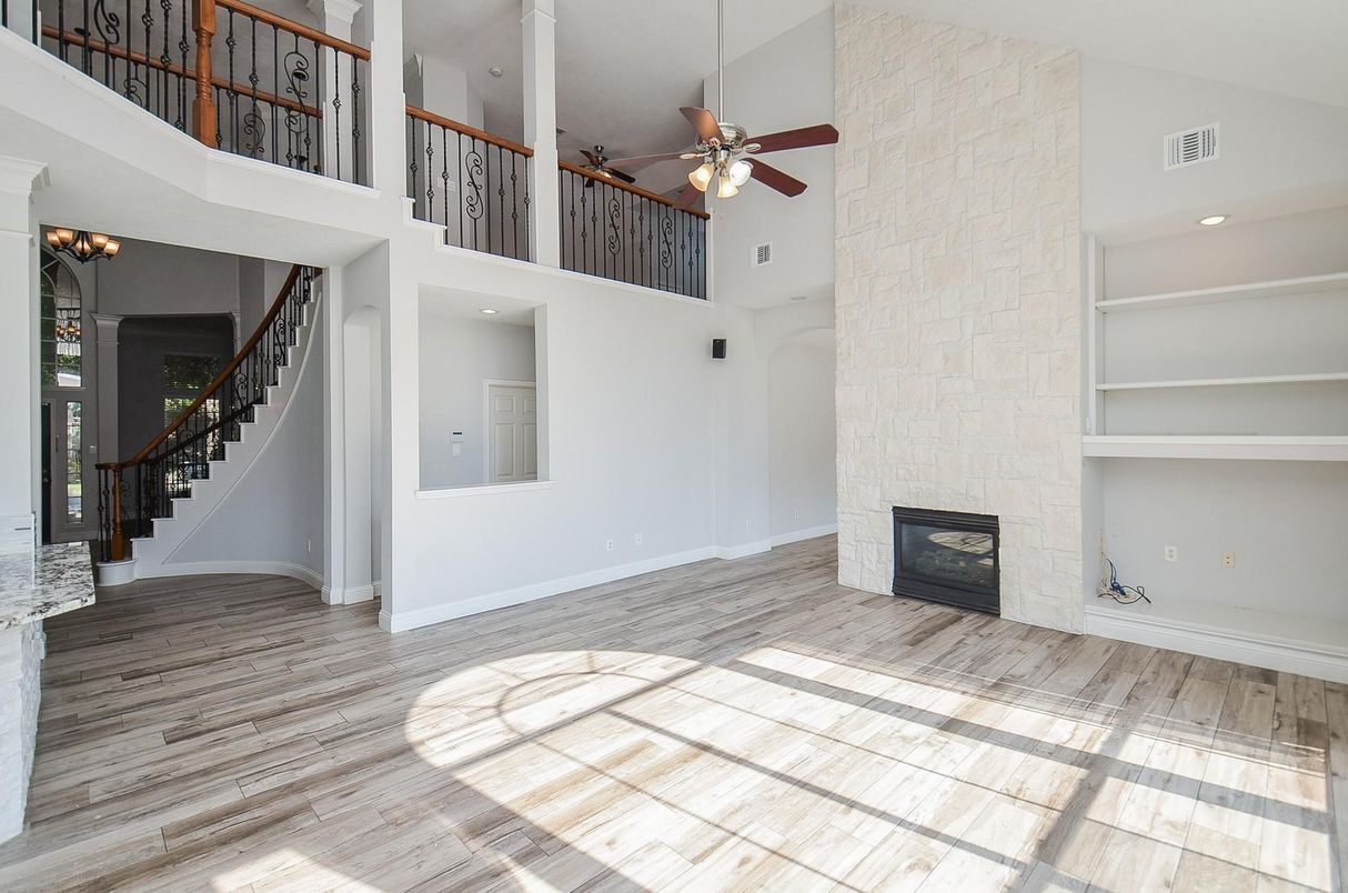 Empty room, Fireplace, Interior, Recessed Lighting, Stone Walls, Wood Texture Flooring