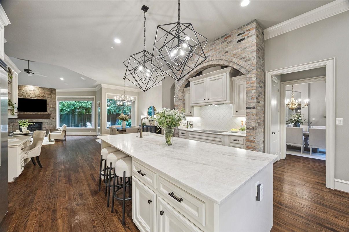 Chandelier, Dining room, Fireplace, Interior, Kitchen, Pendant Lights, Recessed Lighting, Stone Walls, Wood Texture Flooring