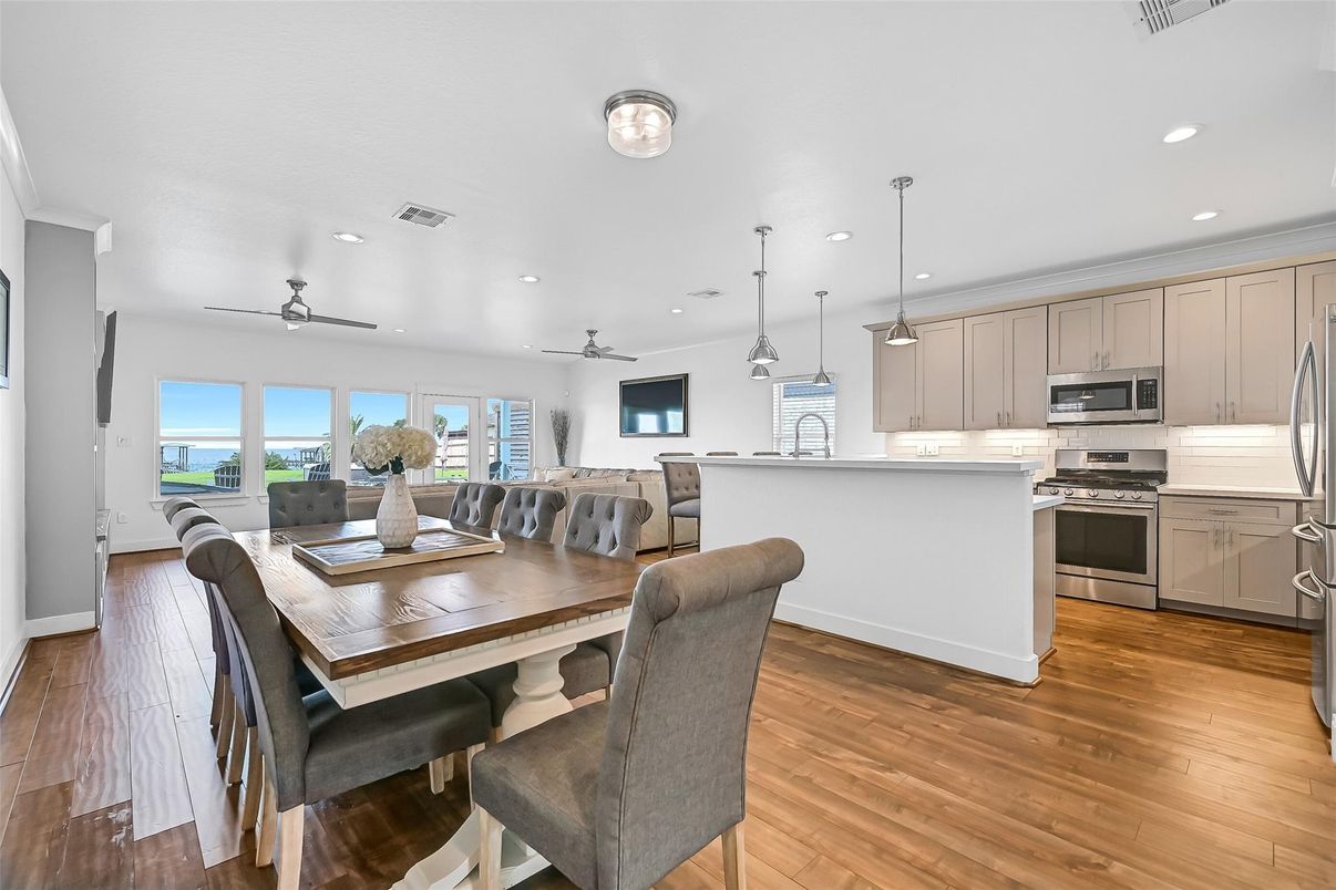 Dining room, Interior, Kitchen, Pendant Lights, Recessed Lighting, Stainless Steel Appliances, Wood Texture Flooring