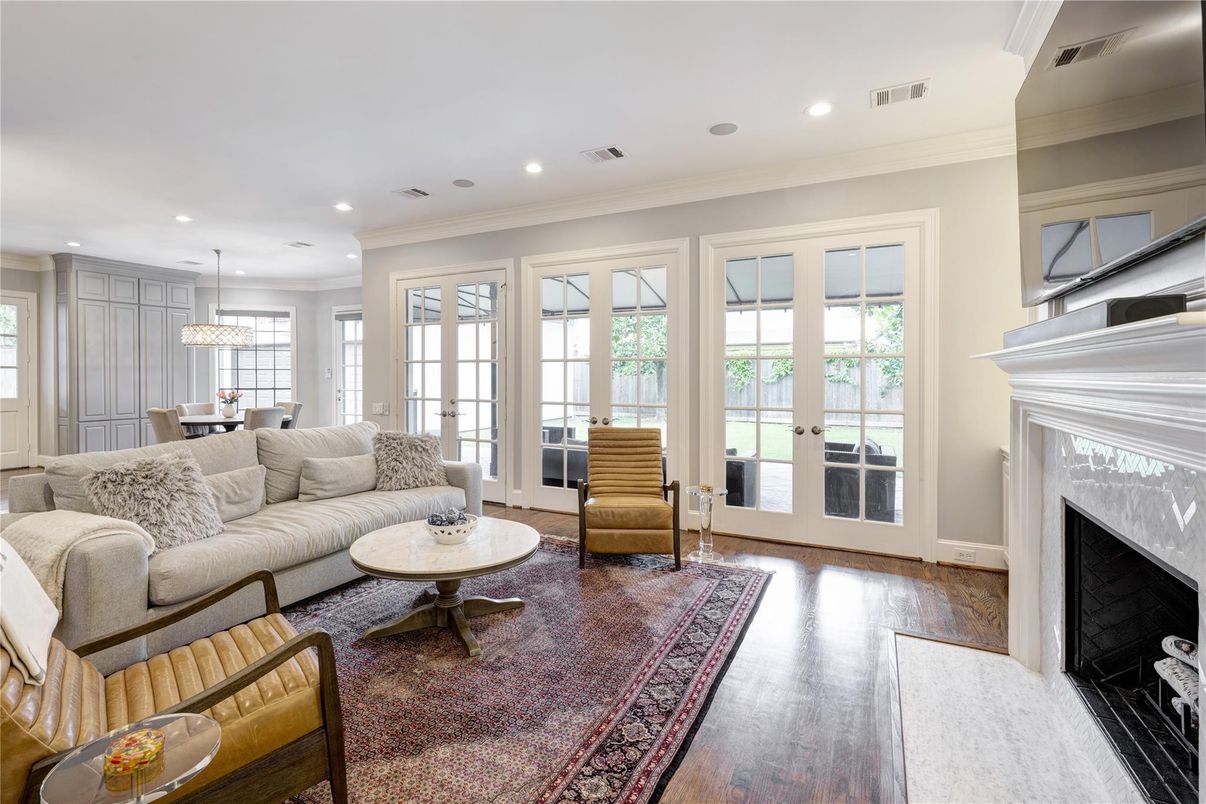 Chandelier, Dining room, Fireplace, Interior, Living room, Pendant Lights, Recessed Lighting, Wood Texture Flooring