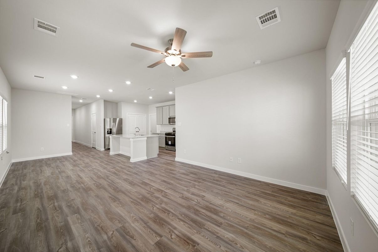 Empty room, Interior, Kitchen, Recessed Lighting, Stainless Steel Appliances, Wood Texture Flooring