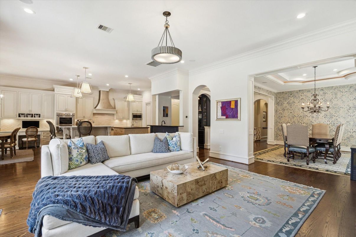 Chandelier, Dining room, Interior, Kitchen, Living room, Pendant Lights, Recessed Lighting, Stainless Steel Appliances, Wood Texture Flooring