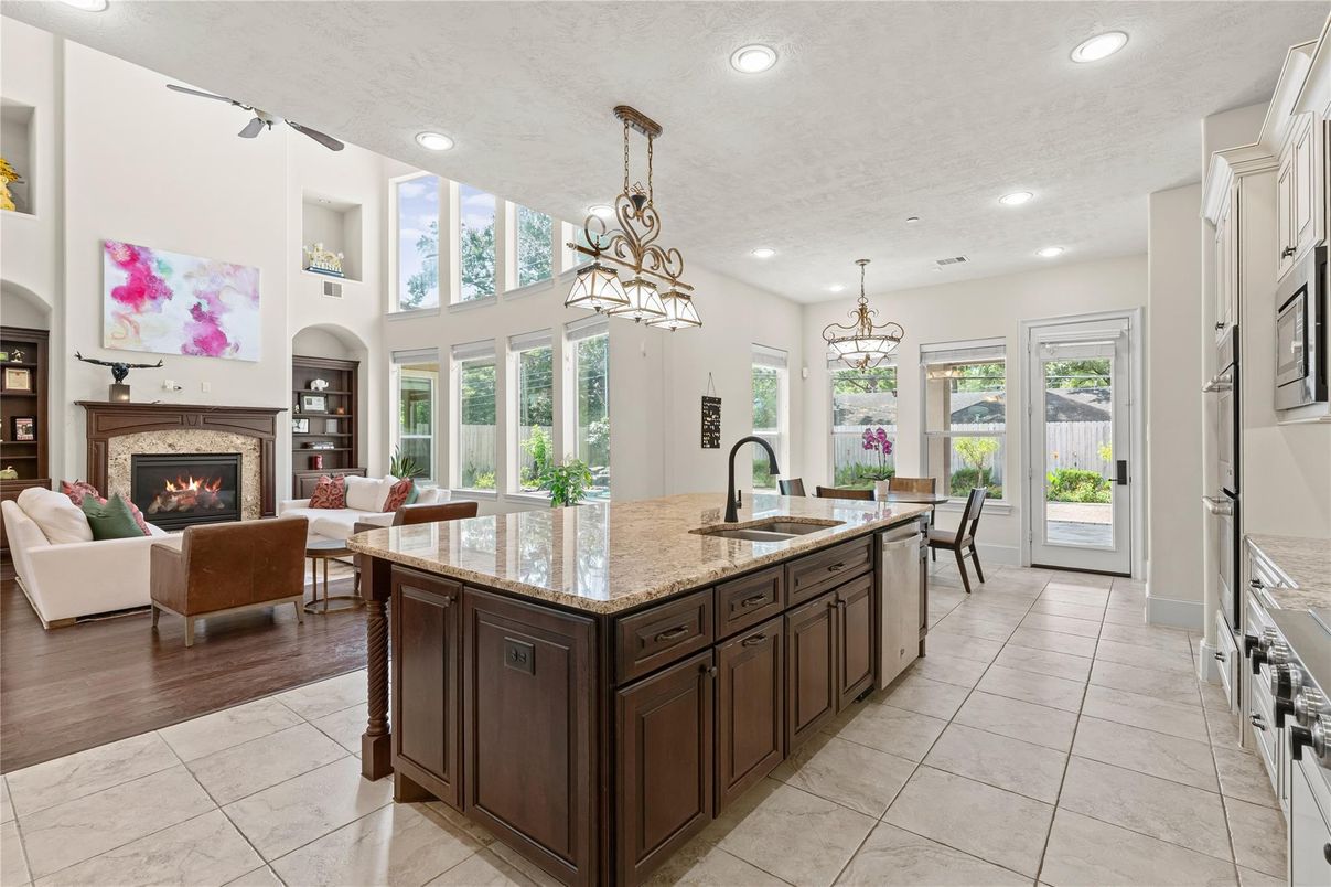 Chandelier, Dining room, Fireplace, Interior, Kitchen, Living room, Pendant Lights, Recessed Lighting, Wood Texture Flooring