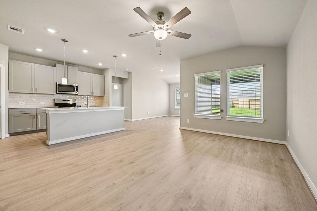 Empty room, Interior, Kitchen, Pendant Lights, Recessed Lighting, Stainless Steel Appliances, Wood Texture Flooring