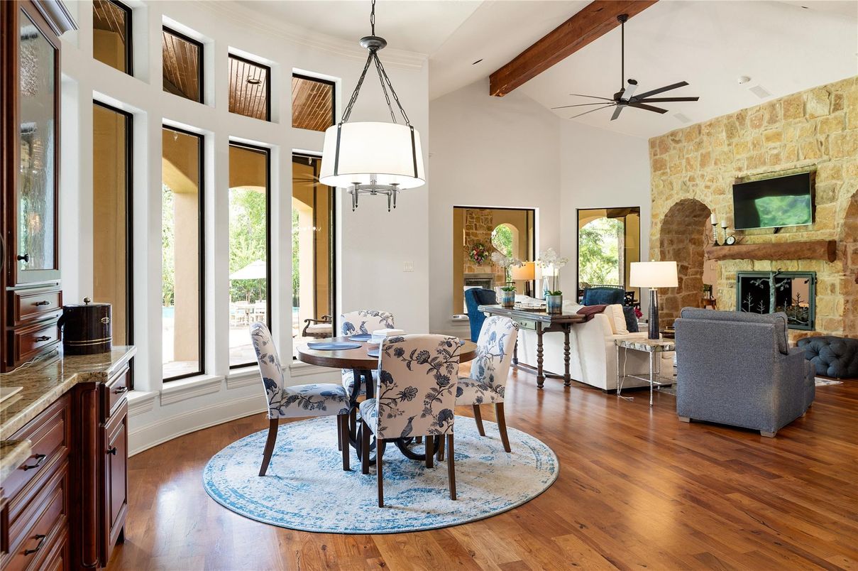 Dining room, Fireplace, Interior, Living room, Pendant Lights, Recessed Lighting, Stone Walls, Wooden Beams, Wood Texture Flooring