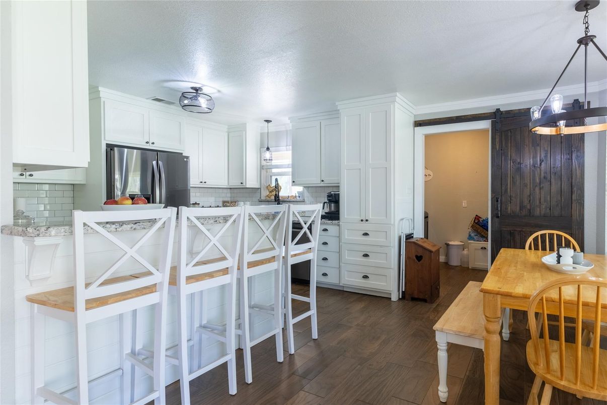 Dining room, Interior, Kitchen, Pendant Lights, Stainless Steel Appliances, Wood Texture Flooring