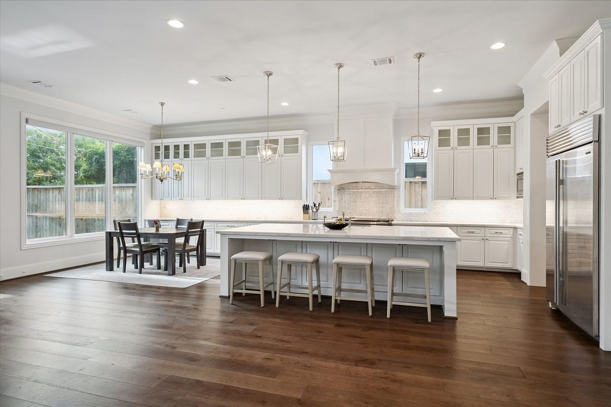 Chandelier, Dining room, Interior, Kitchen, Pendant Lights, Recessed Lighting, Stainless Steel Appliances, Wood Texture Flooring