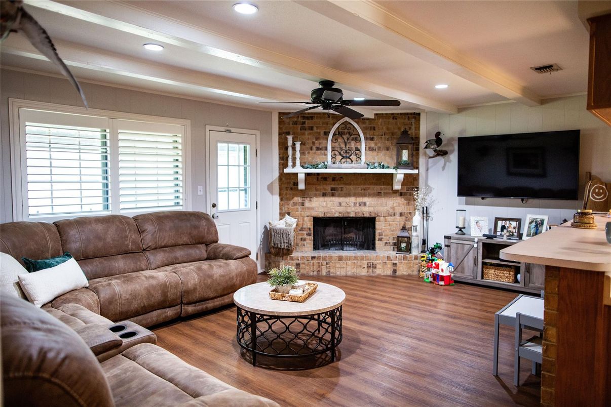 Fireplace, Interior, Living room, Recessed Lighting, Stone Walls, Wood Texture Flooring