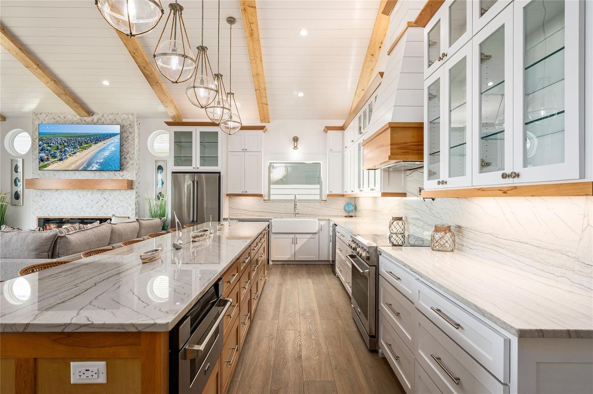 Fireplace, Interior, Kitchen, Pendant Lights, Recessed Lighting, Stainless Steel Appliances, Wooden Beams, Wood Texture Flooring