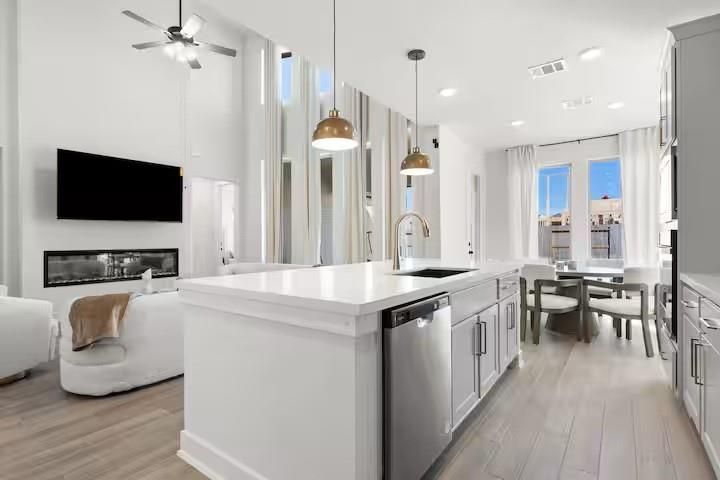 Dining room, Fireplace, Interior, Kitchen, Living room, Pendant Lights, Recessed Lighting, Stainless Steel Appliances, Wood Texture Flooring