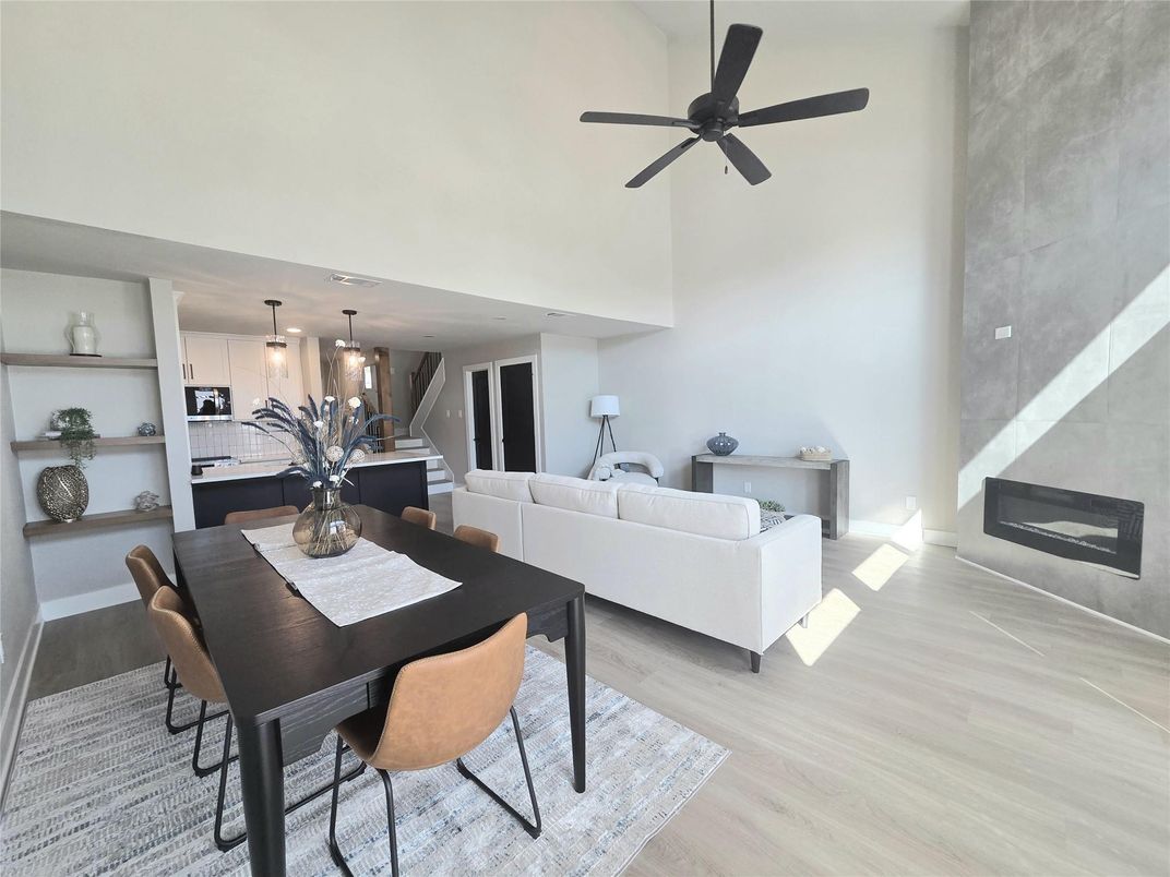Dining room, Fireplace, Interior, Kitchen, Living room, Pendant Lights, Stainless Steel Appliances, Wood Texture Flooring