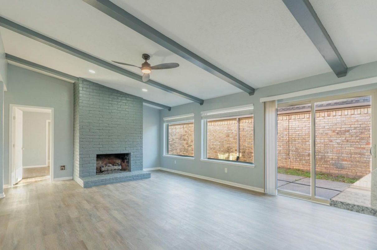 Empty room, Fireplace, Interior, Recessed Lighting, Stone Walls, Wood Texture Flooring