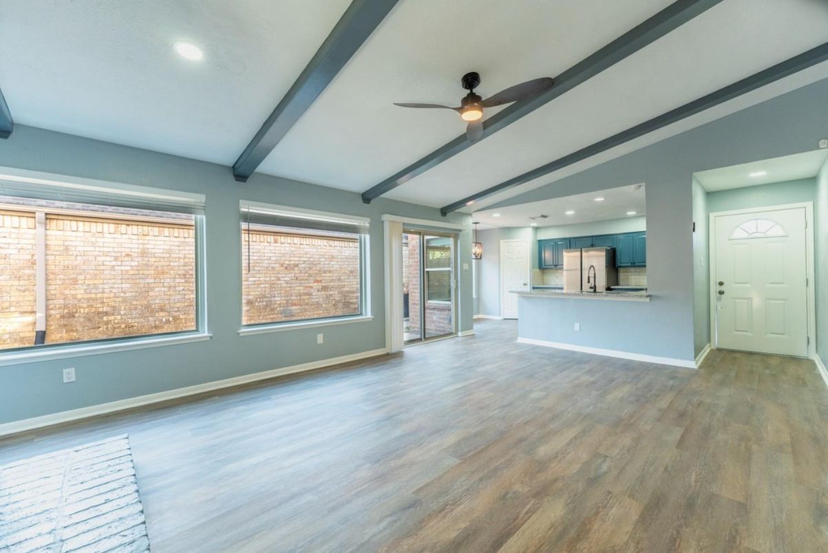 Empty room, Interior, Kitchen, Recessed Lighting, Stainless Steel Appliances, Wood Texture Flooring