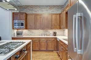 Interior, Kitchen, Stainless Steel Appliances, Tile Countertops, Wood Texture Flooring