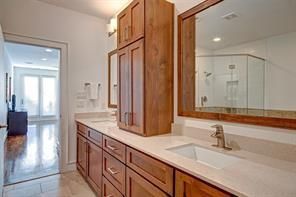 Bathroom, Dual Sink Vanities, Glass Shower, Interior, Recessed Lighting, Wood Texture Flooring