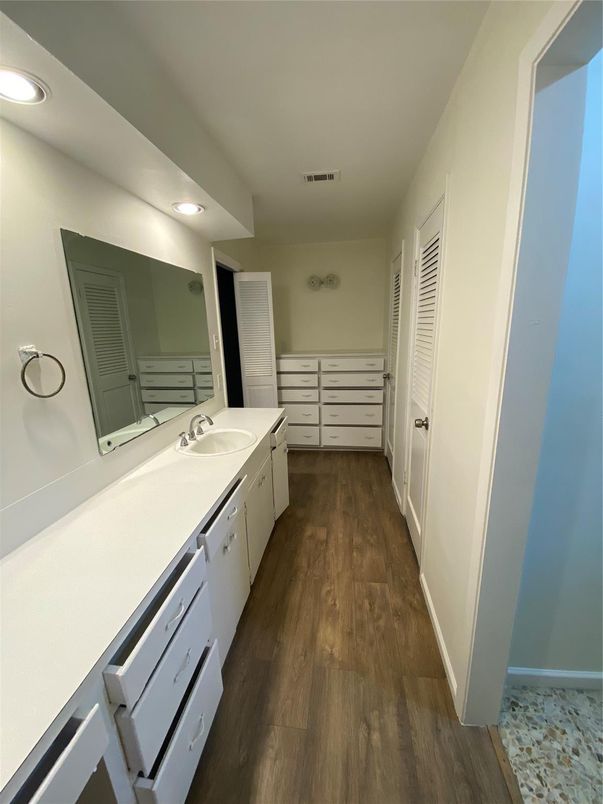 Bathroom, Dual Sink Vanities, Interior, Recessed Lighting, Wood Texture Flooring