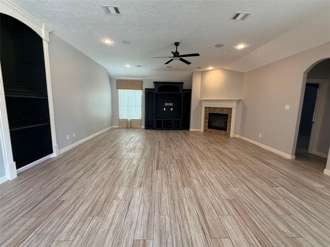 Empty room, Fireplace, Interior, Recessed Lighting, Wood Texture Flooring