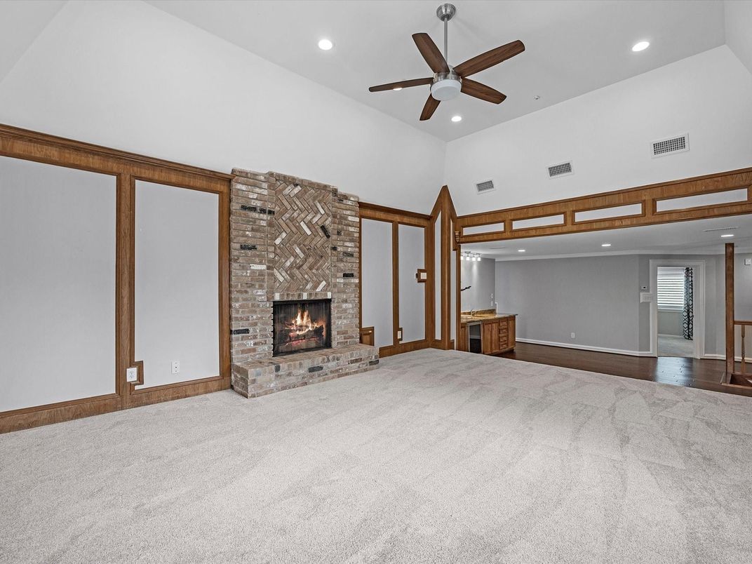 Empty room, Fireplace, Interior, Recessed Lighting, Stone Walls, Wood Texture Flooring