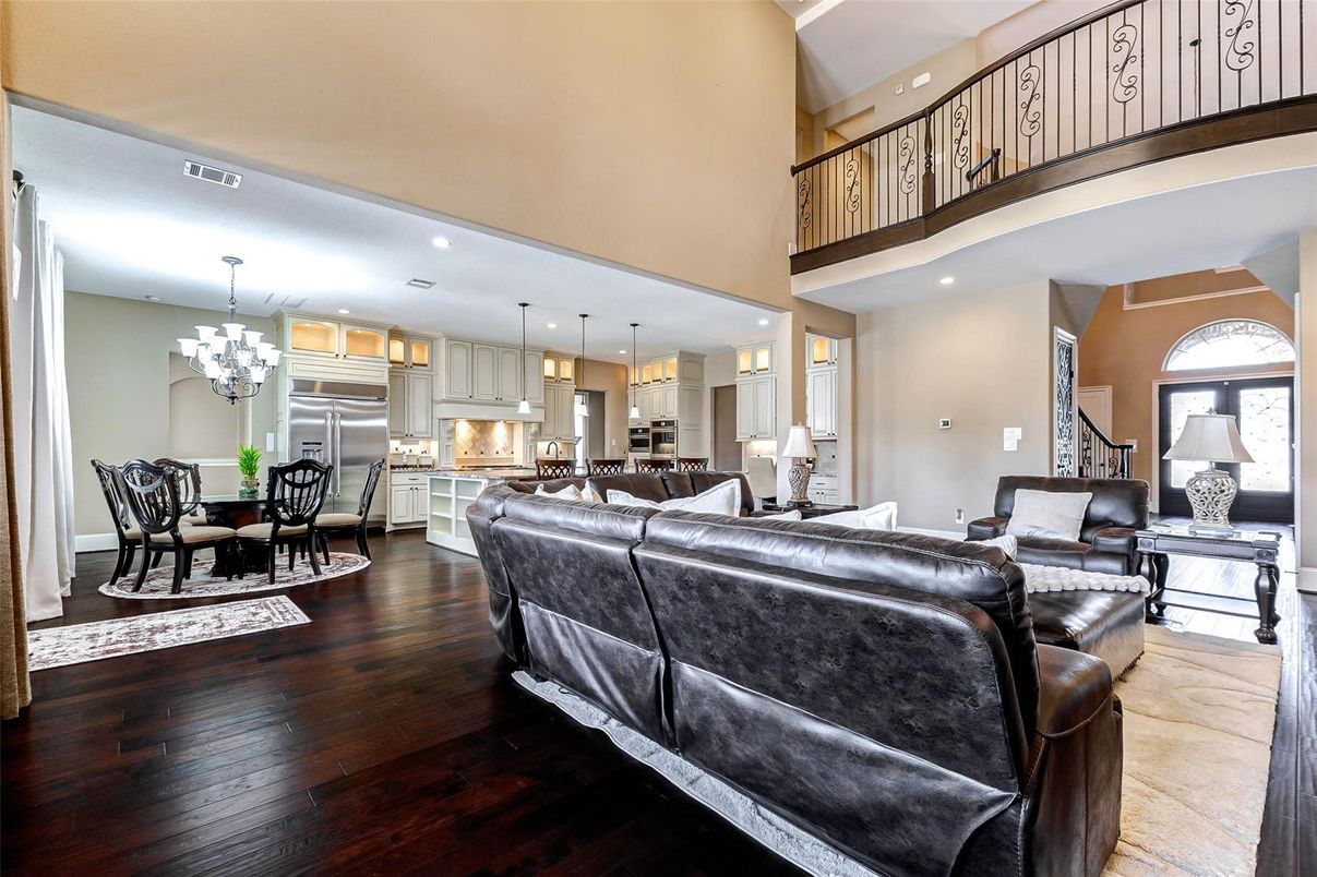 Chandelier, Dining room, Interior, Kitchen, Living room, Pendant Lights, Recessed Lighting, Stainless Steel Appliances, Wood Texture Flooring