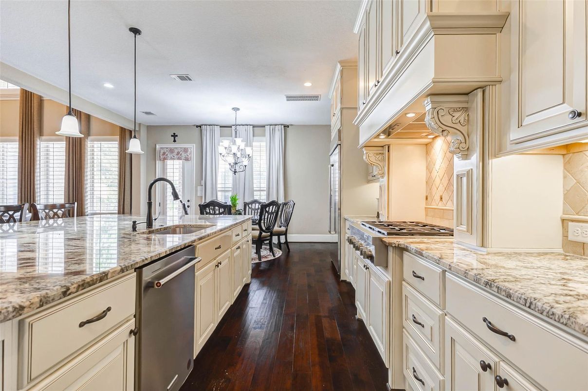 Chandelier, Dining room, Interior, Kitchen, Pendant Lights, Recessed Lighting, Stainless Steel Appliances, Wood Texture Flooring