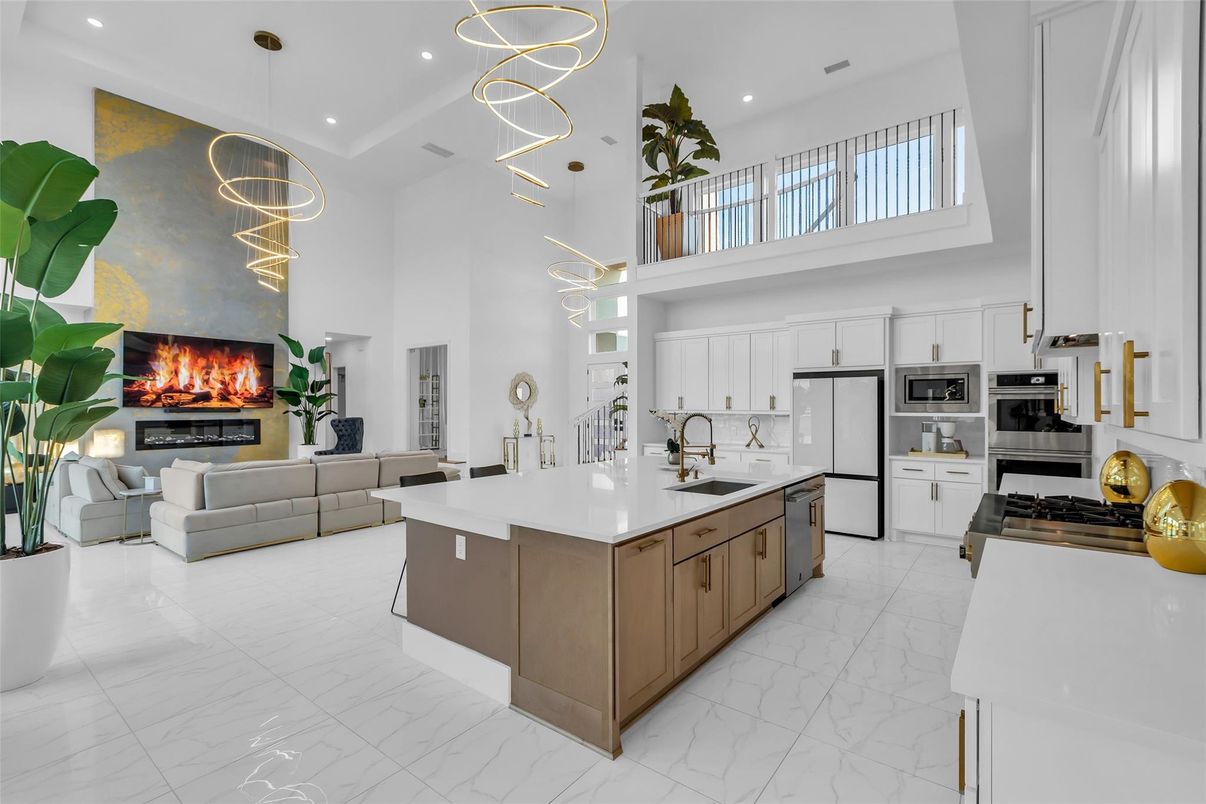 Fireplace, Interior, Kitchen, Living room, Marble, Pendant Lights, Recessed Lighting, Stainless Steel Appliances