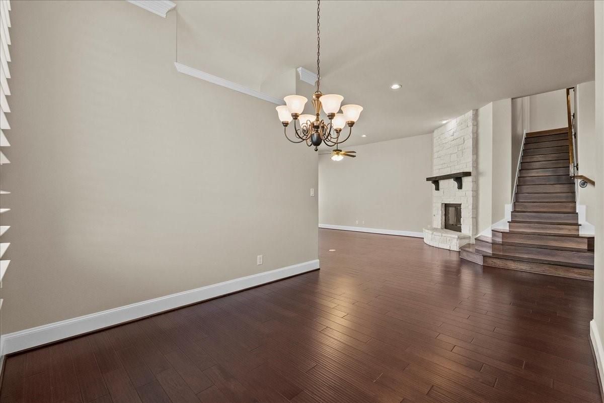 Chandelier, Empty room, Fireplace, Interior, Recessed Lighting, Wood Texture Flooring