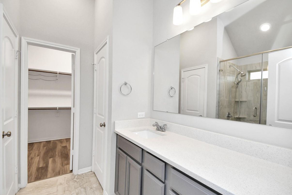 Bathroom, Dual Sink Vanities, Glass Shower, Interior, Marble, Recessed Lighting, Wood Texture Flooring