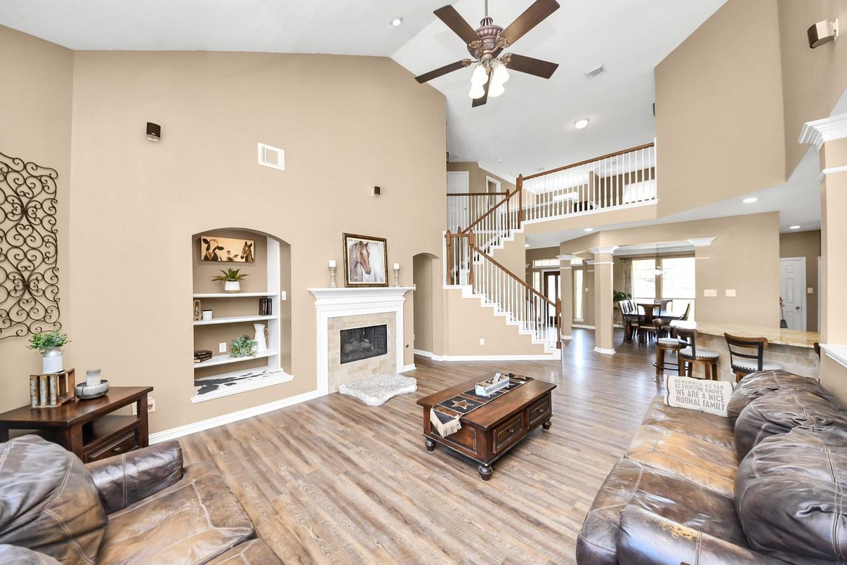 Dining room, Fireplace, Interior, Living room, Recessed Lighting, Wood Texture Flooring