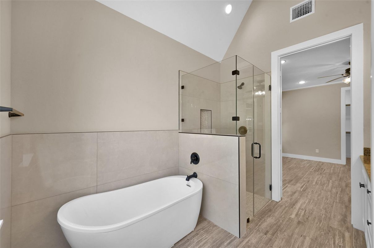 Bathroom, Free Standing Baths, Glass Shower, Interior, Recessed Lighting, Wood Texture Flooring