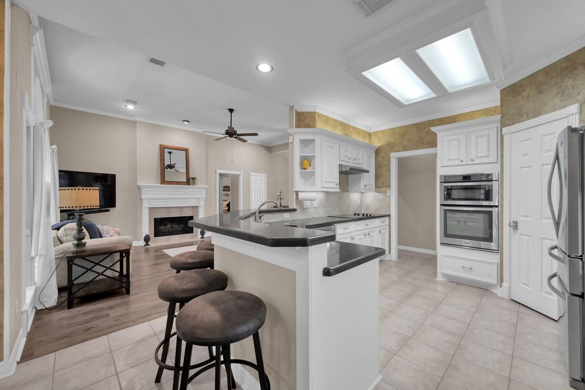 Fireplace, Interior, Kitchen, Living room, Recessed Lighting, Stainless Steel Appliances