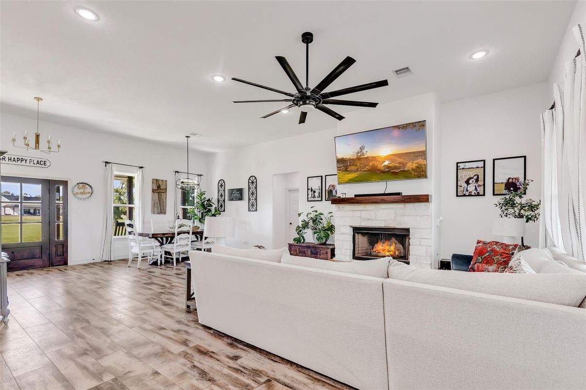 Dining room, Fireplace, Interior, Living room, Pendant Lights, Recessed Lighting, Wood Texture Flooring