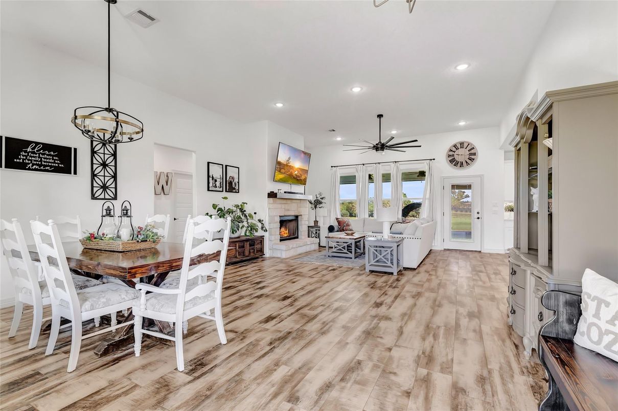 Dining room, Fireplace, Interior, Living room, Pendant Lights, Recessed Lighting, Wood Texture Flooring
