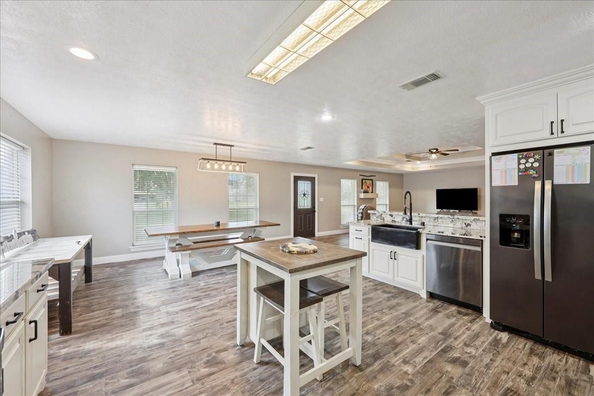 Dining room, Interior, Kitchen, Pendant Lights, Recessed Lighting, Stainless Steel Appliances, Wood Texture Flooring