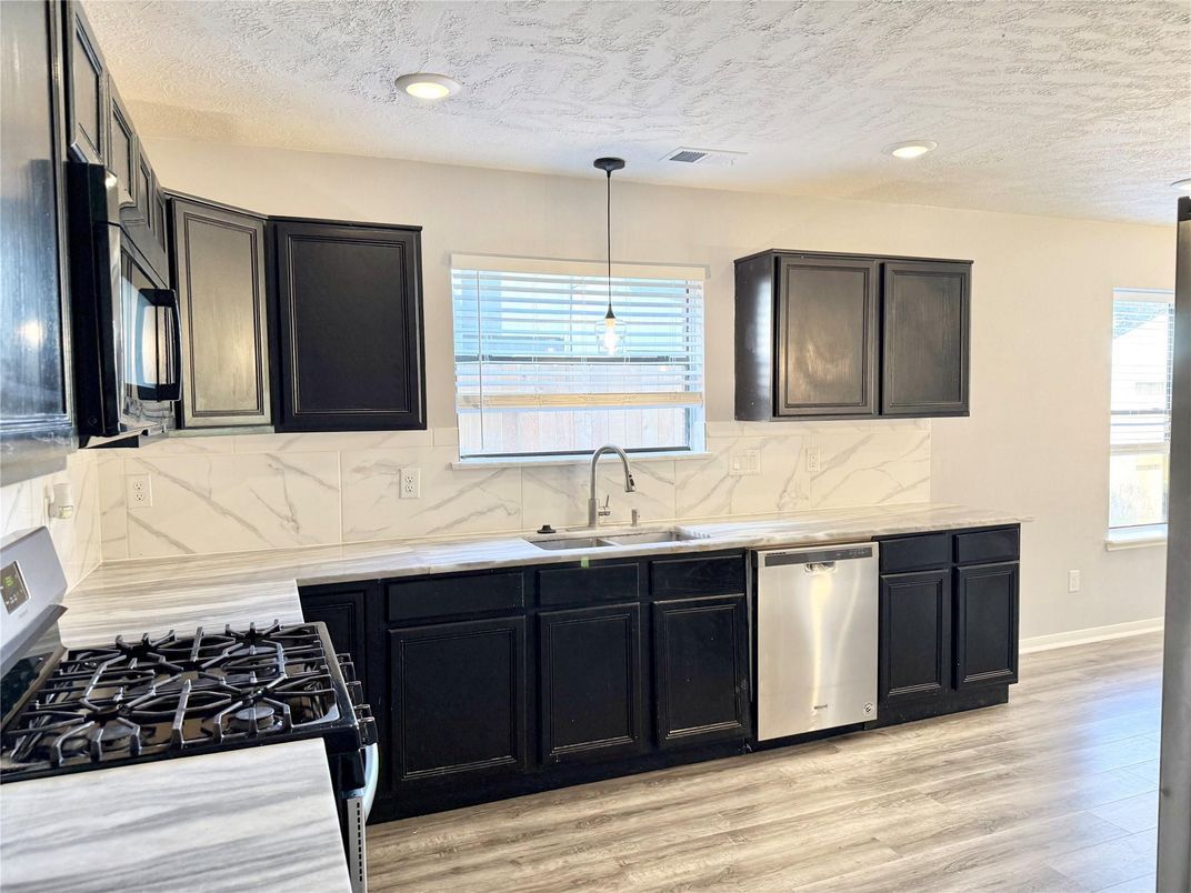 Interior, Kitchen, Marble Walls, Pendant Lights, Recessed Lighting, Wood Texture Flooring