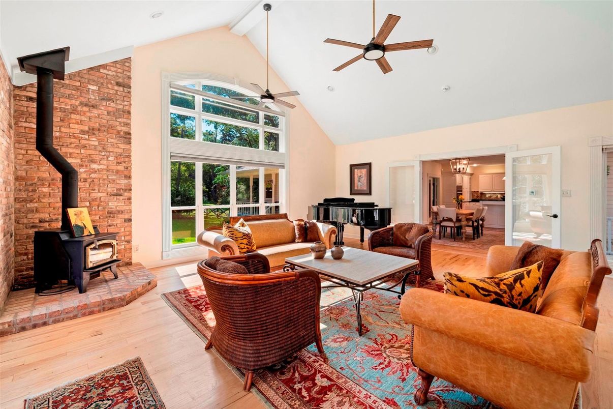 Dining room, Fireplace, Interior, Living room, Piano, Stone Walls, Wood Texture Flooring