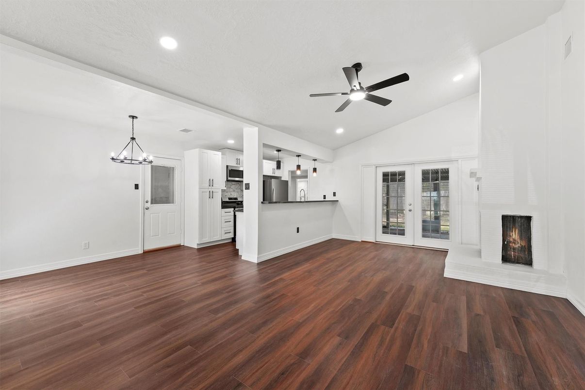 Empty room, Fireplace, Interior, Kitchen, Pendant Lights, Recessed Lighting, Wood Texture Flooring