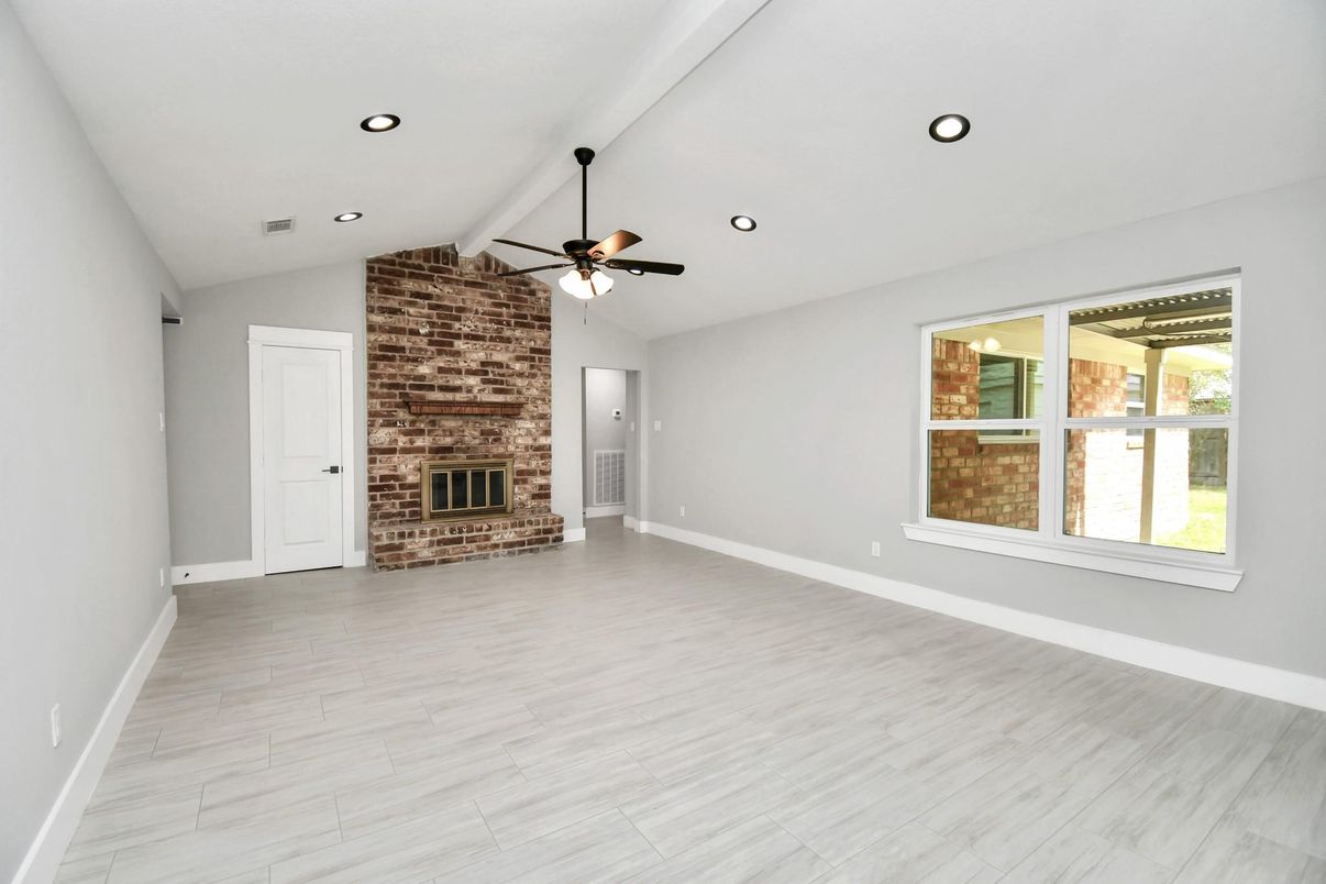 Empty room, Fireplace, Interior, Recessed Lighting, Stone Walls, Wood Texture Flooring
