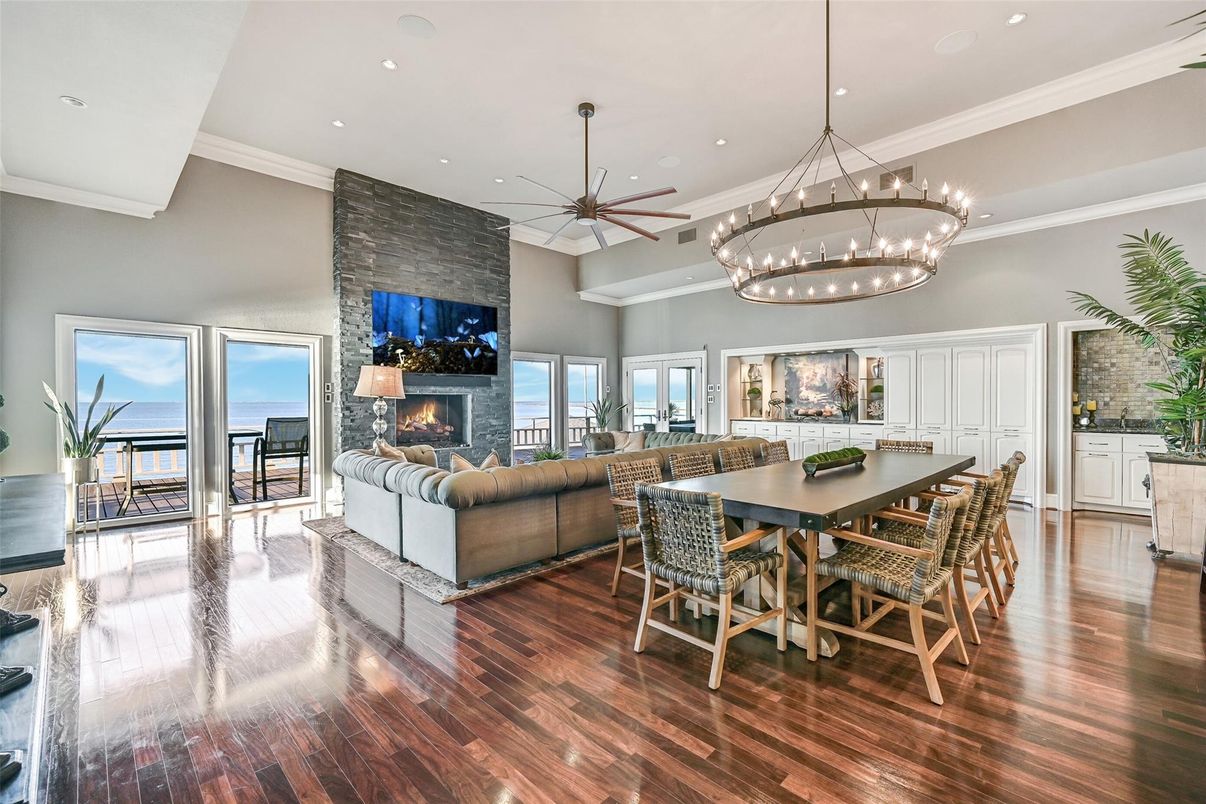Chandelier, Dining room, Fireplace, Interior, Living room, Pendant Lights, Recessed Lighting, Water, Wood Texture Flooring