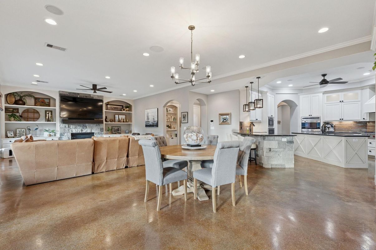 Chandelier, Dining room, Fireplace, Interior, Kitchen, Living room, Pendant Lights, Recessed Lighting, Stainless Steel Appliances