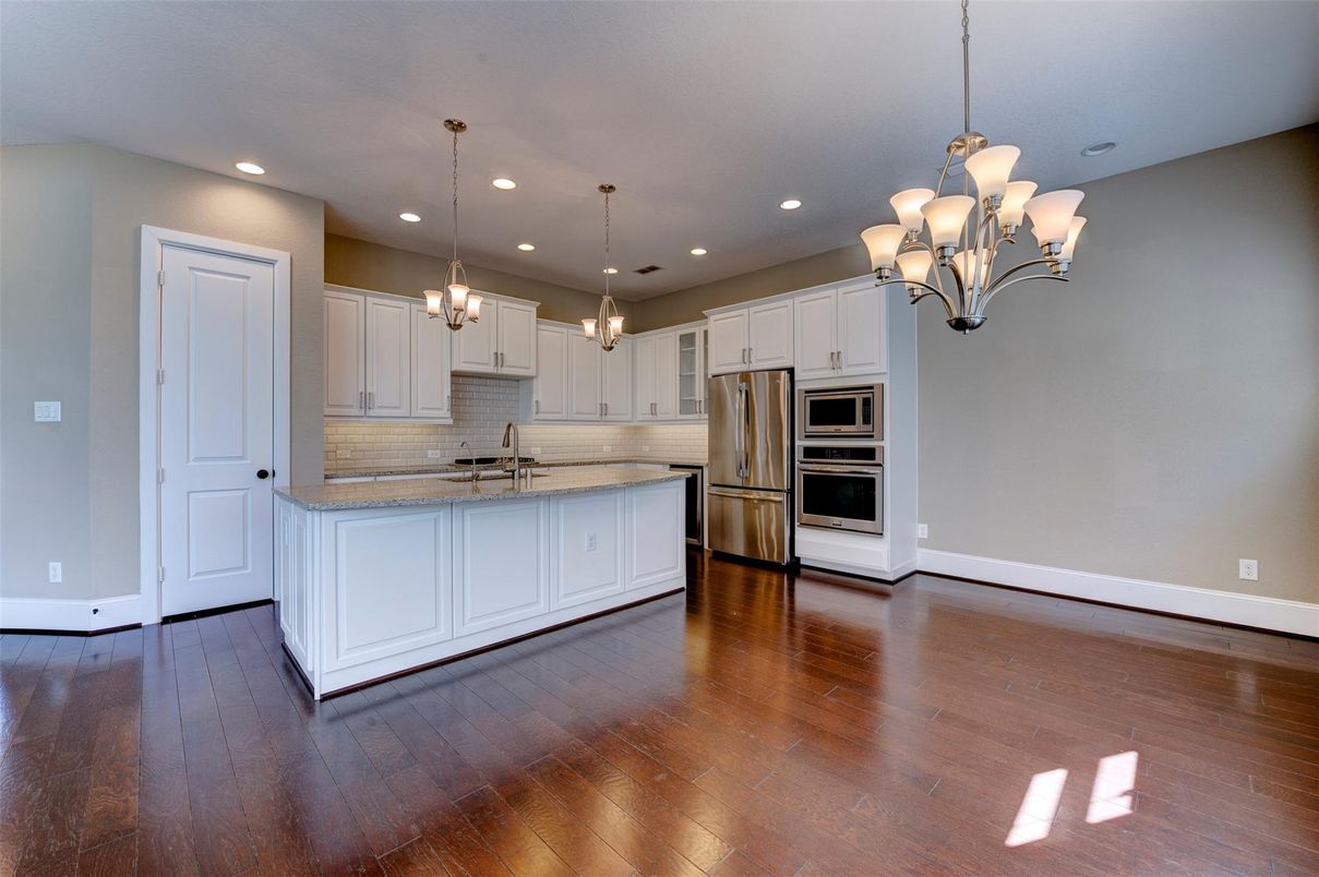 Chandelier, Interior, Kitchen, Pendant Lights, Recessed Lighting, Stainless Steel Appliances, Wood Texture Flooring