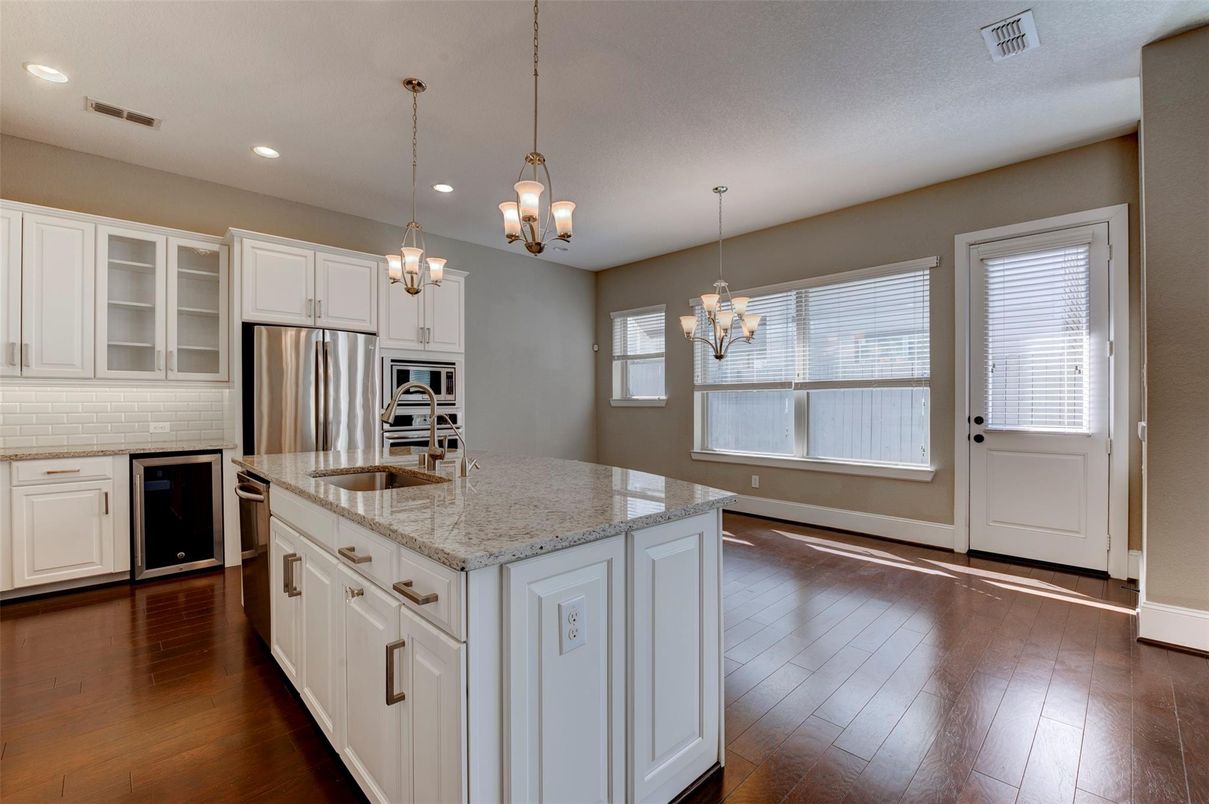 Chandelier, Interior, Kitchen, Pendant Lights, Recessed Lighting, Stainless Steel Appliances, Wood Texture Flooring