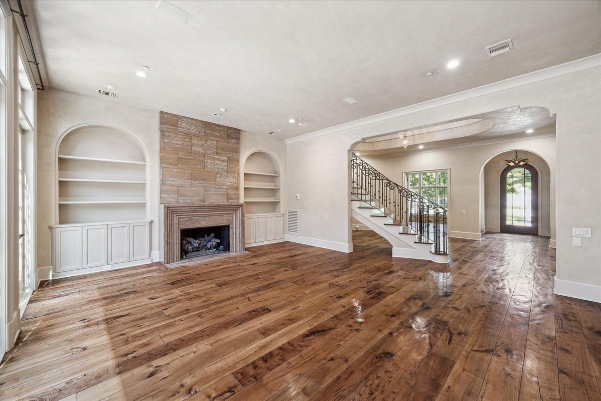 Empty room, Fireplace, Interior, Recessed Lighting, Stone Walls, Wood Texture Flooring