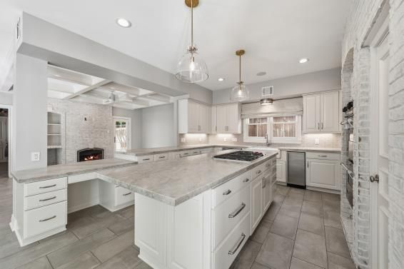 Fireplace, Interior, Kitchen, Pendant Lights, Recessed Lighting, Stainless Steel Appliances, Stone Walls
