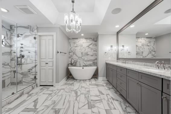 Bathroom, Chandelier, Dual Sink Vanities, Free Standing Baths, Glass Shower, Interior, Marble, Marble Walls, Pendant Lights, Recessed Lighting