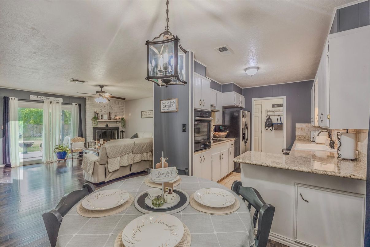 Dining room, Fireplace, Interior, Kitchen, Living room, Pendant Lights, Wood Texture Flooring