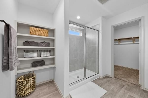 Bathroom, Glass Shower, Interior, Recessed Lighting, Walk-in Closets, Wood Texture Flooring