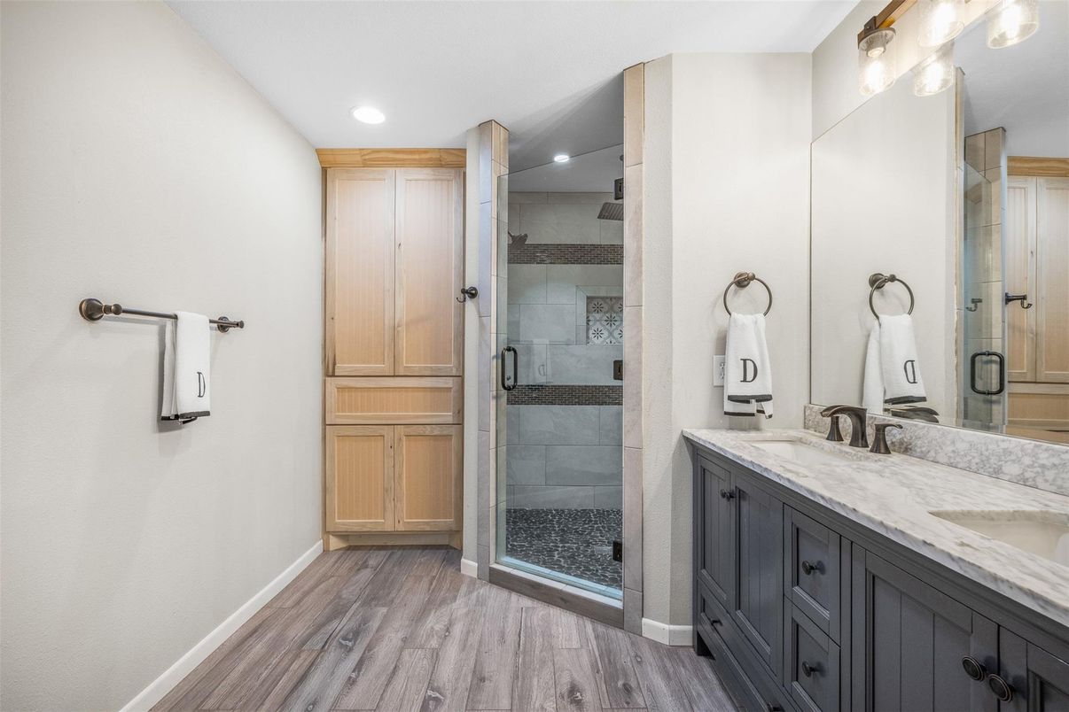 Bathroom, Dual Sink Vanities, Glass Shower, Interior, Recessed Lighting, Wood Texture Flooring