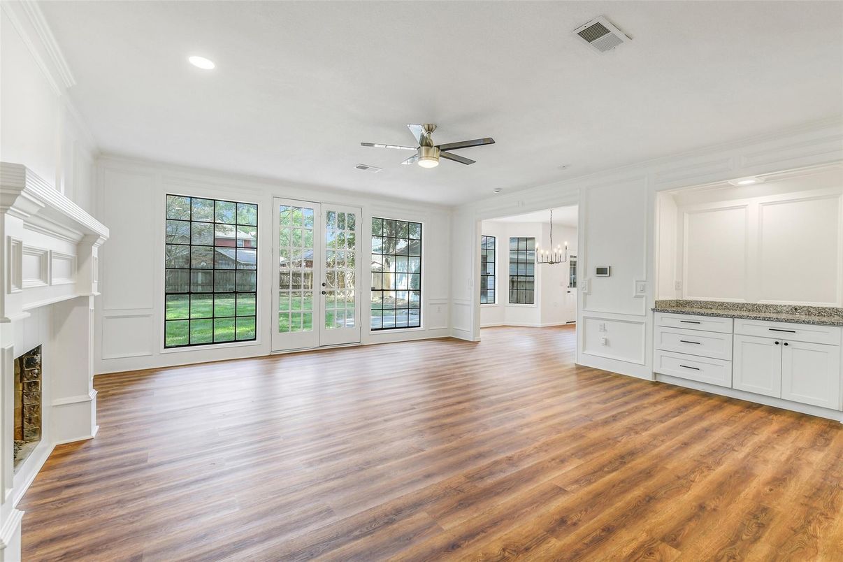 Chandelier, Empty room, Fireplace, Interior, Recessed Lighting, Wood Texture Flooring